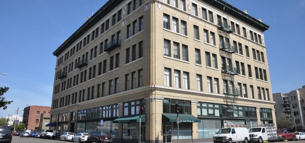 Large tan building serving as the Ratto Law Firm office, showcasing a professional and welcoming exterior